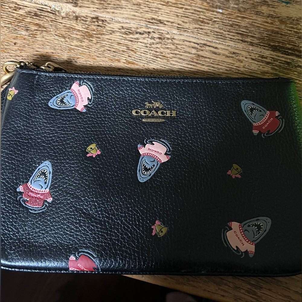 Coach wristlet! Black leather and sharks!!! Never used!